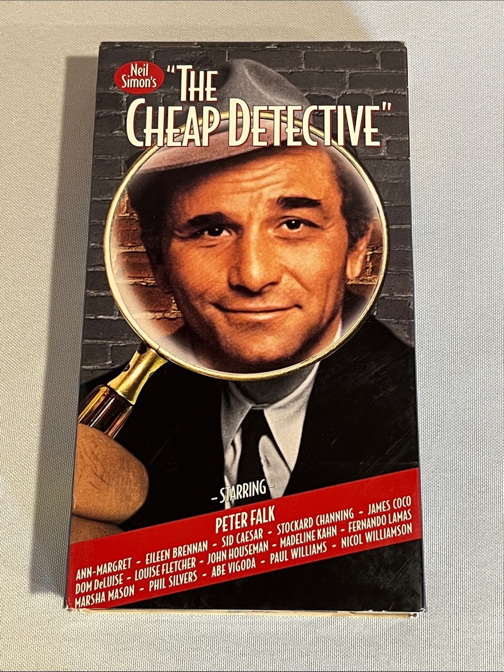 Neil Simon's "The Cheap Detective" VHS — Black, Red